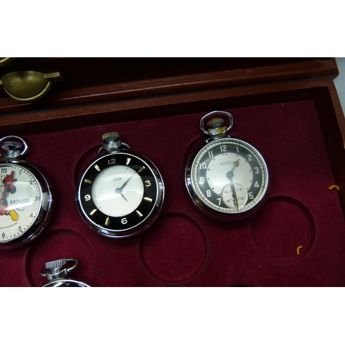 899 - A three-drawer cabinet containing thirty 'dollar' and other pocket watches, including Disney Mickey ... 