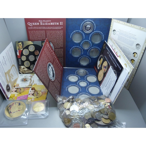 901 - Coins; coin packs, two Winnie the Pooh 50p coins, two Queen Elizabeth II 90th Birthday coins, a 2009... 