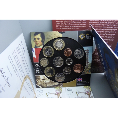 901 - Coins; coin packs, two Winnie the Pooh 50p coins, two Queen Elizabeth II 90th Birthday coins, a 2009... 