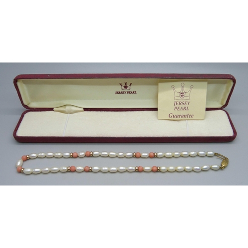 904 - A Jersey Pearl necklace with 9ct gold clasp, boxed