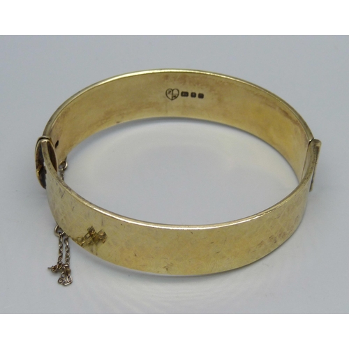 910 - A 22ct gold on silver bangle, 43g