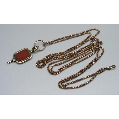 913 - A Victorian long guard chain and an antique watch key/fob