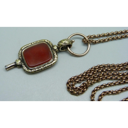 913 - A Victorian long guard chain and an antique watch key/fob