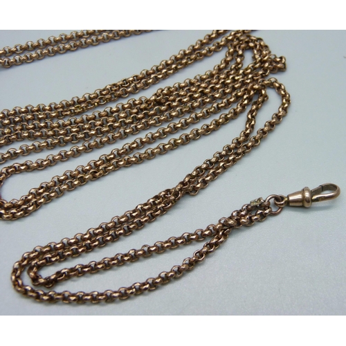 913 - A Victorian long guard chain and an antique watch key/fob