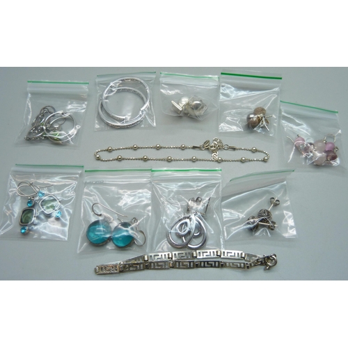 914 - Ten pairs of silver earrings and two 925 silver bracelets