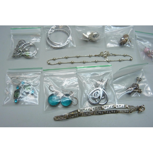 914 - Ten pairs of silver earrings and two 925 silver bracelets