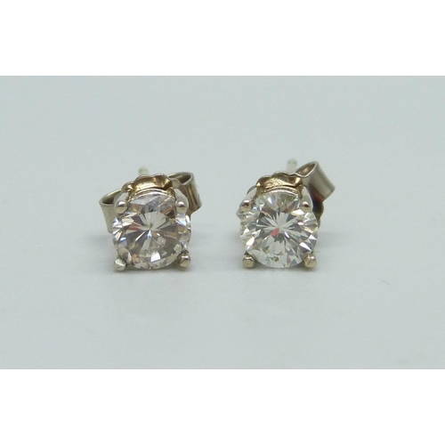 916 - A pair of diamond stud earrings, set in 18ct white gold, 1.2 carat diamond weight