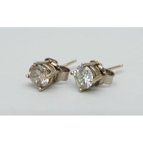 916 - A pair of diamond stud earrings, set in 18ct white gold, 1.2 carat diamond weight