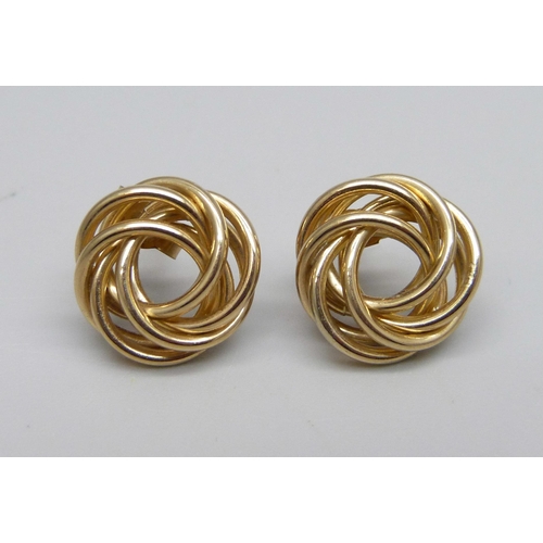 917 - A pair of 9ct gold knot earrinsg with gold butterflies, tested, 1.7g