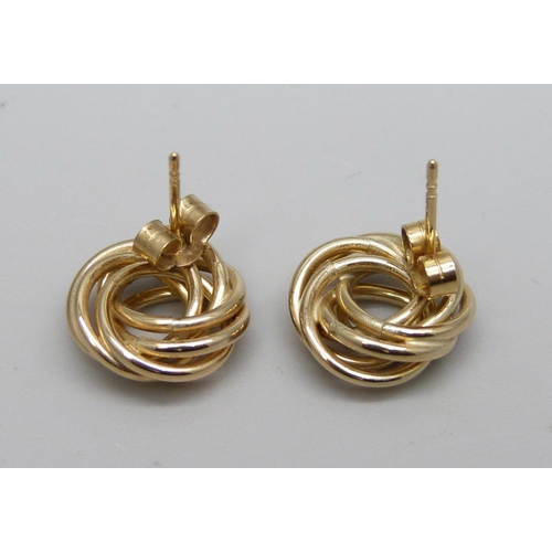 917 - A pair of 9ct gold knot earrinsg with gold butterflies, tested, 1.7g