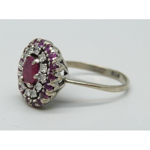 932 - A ruby and diamond cluster ring, marked 950, 4.6g, O