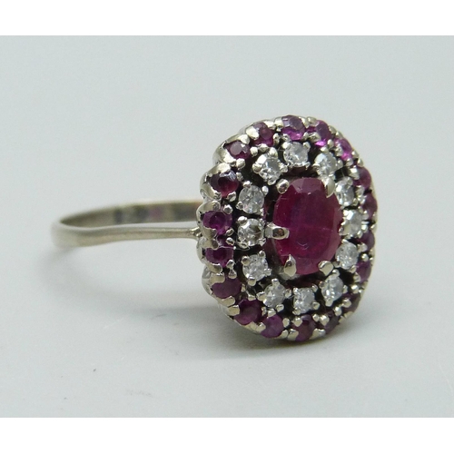 932 - A ruby and diamond cluster ring, marked 950, 4.6g, O