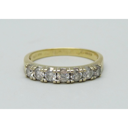 934 - An 18ct gold, seven stone diamond ring, approximate 0.60ct diamond weight, 3.8g, Q