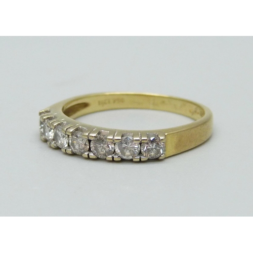 934 - An 18ct gold, seven stone diamond ring, approximate 0.60ct diamond weight, 3.8g, Q