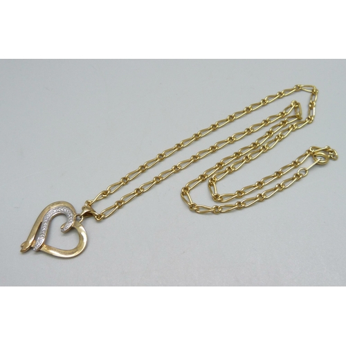 940 - A silver gilt and diamond pendant on a gold plated chain