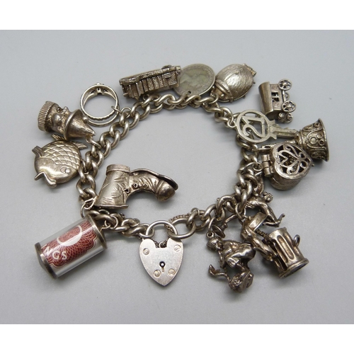 957 - A heavy silver charm bracelet, 90g