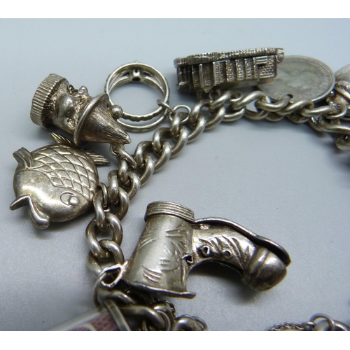 957 - A heavy silver charm bracelet, 90g