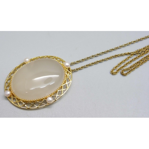 963 - A silver gilt, white agate and freshwater pearl pendant on a plated chain, with certificate