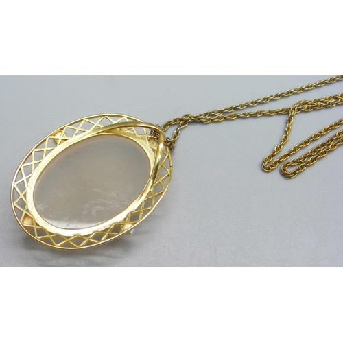 963 - A silver gilt, white agate and freshwater pearl pendant on a plated chain, with certificate