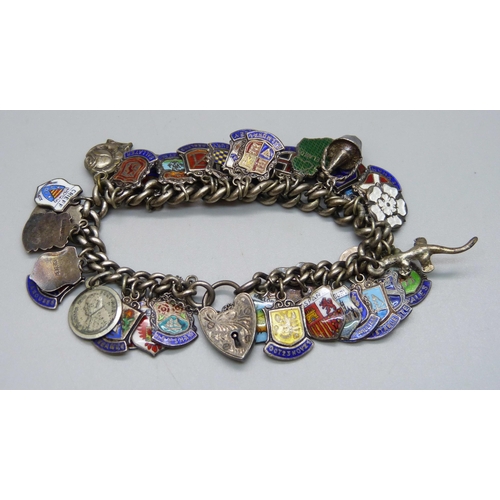 964 - A silver charm bracelet, 75g