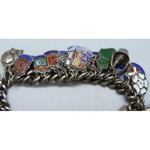 964 - A silver charm bracelet, 75g