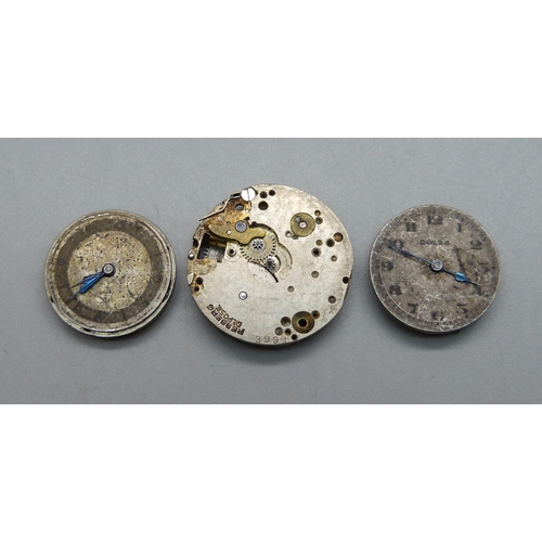 972 - An Omega watch movement, a Rolex watch movement and a Rolex part movement