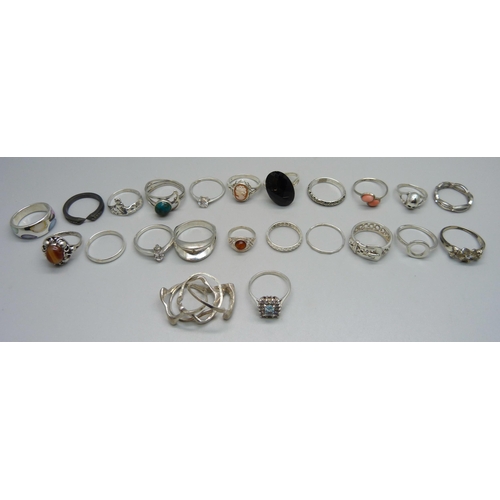 979 - Twenty-three silver rings including one set with black diamonds, (all test as silver), 63g