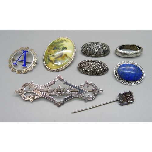 980 - Six silver brooches, a scarf clip and a stick pin, (all test as silver)