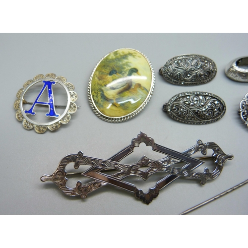 980 - Six silver brooches, a scarf clip and a stick pin, (all test as silver)