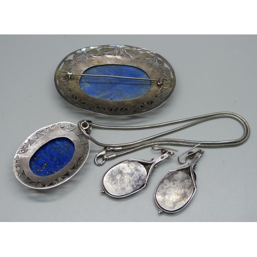 981 - A lapis lazuli and silver jewellery suite; a brooch, pendant and earrings, boxed