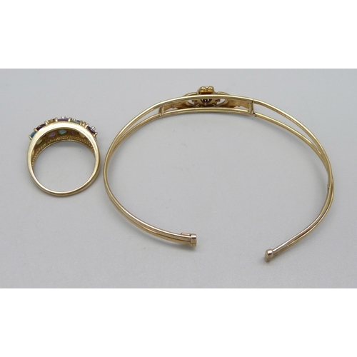 985 - A 9ct gold bangle, 5.2g, a/f, and a 9ct gold multi-coloured stone set ring, 3.4g, P