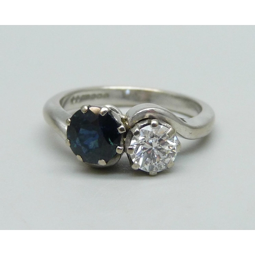 987 - An 18ct white gold, diamond and sapphire ring, approximately 0.5ct diamond and 1ct sapphire, 5.2g, M