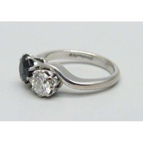 987 - An 18ct white gold, diamond and sapphire ring, approximately 0.5ct diamond and 1ct sapphire, 5.2g, M