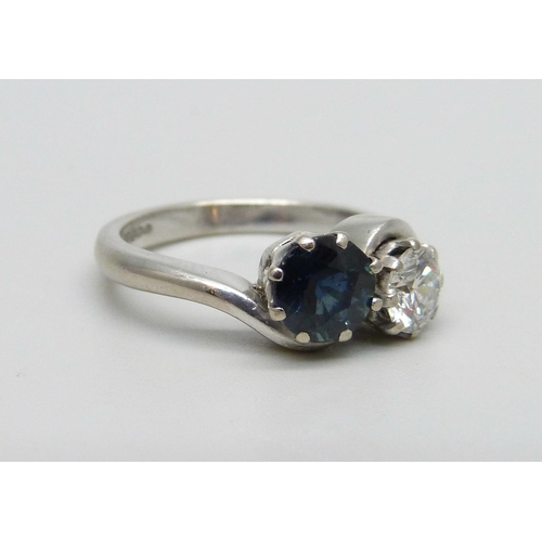 987 - An 18ct white gold, diamond and sapphire ring, approximately 0.5ct diamond and 1ct sapphire, 5.2g, M