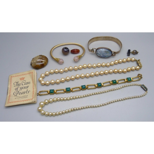 997 - Two bangles, a bracelet, unmounted stones, etc., brooch chipped