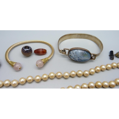 997 - Two bangles, a bracelet, unmounted stones, etc., brooch chipped