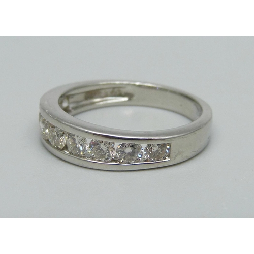 999 - A platinum, nine stone brilliant cut diamond half-eternity ring, shank stamped 1.00ct, 5.6g, M