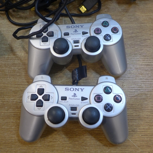 2172 - A Sony Silver Prestige Line PS2 witih two controllers