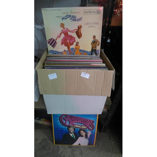 2180 - A box of approximately 60 LP records and 7