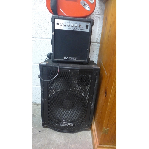 2207 - A red electric guitar, Delta speaker and an Acoustic Solutions amp