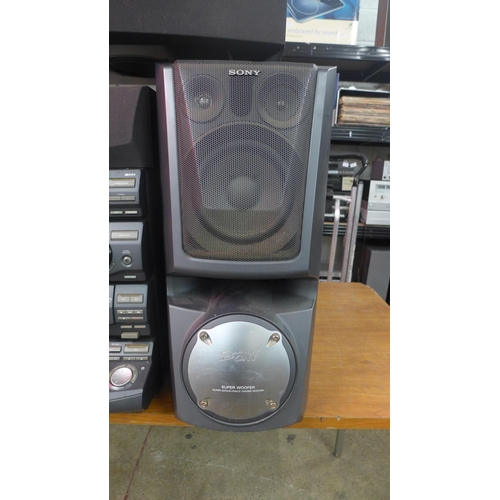 2209 - A Sony stereo with two large speakers (LBT-XB80A) and Cambridge Tu speaker base with bluetooth