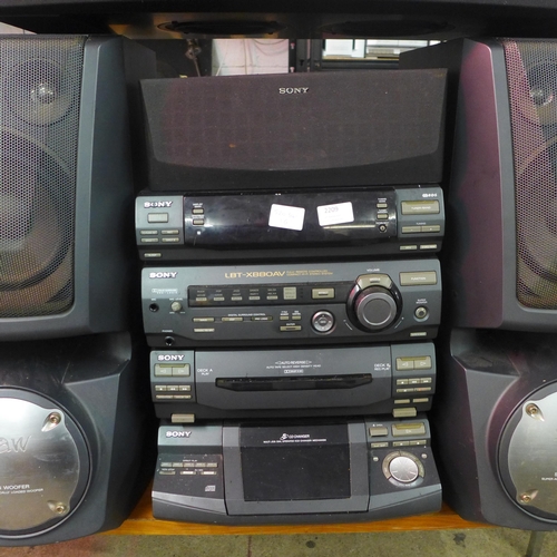 2209 - A Sony stereo with two large speakers (LBT-XB80A) and Cambridge Tu speaker base with bluetooth