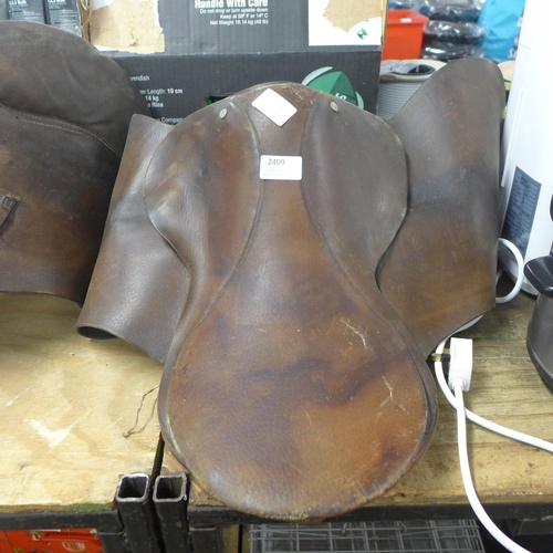 2409 - Two leather horse saddles