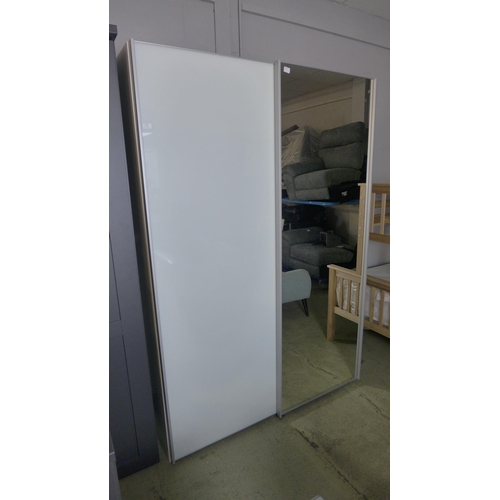 1549 - A white glass and mirrored sliding door wardrobe * this lot is subject to VAT