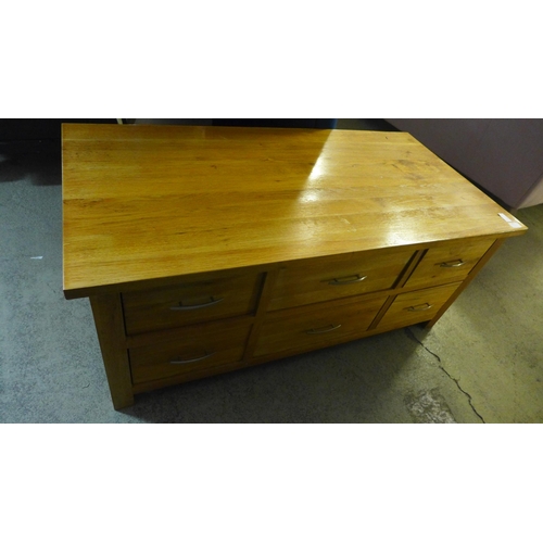 1550 - An oak multi drawer coffee table