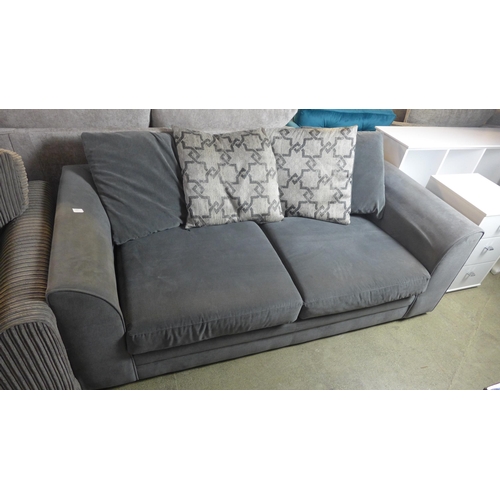 1567 - A mid grey upholstered scatter back three seater sofa with patterned cushions, used