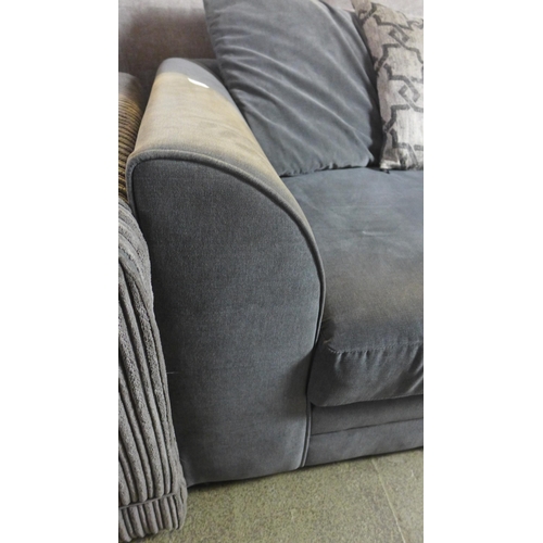 1567 - A mid grey upholstered scatter back three seater sofa with patterned cushions, used