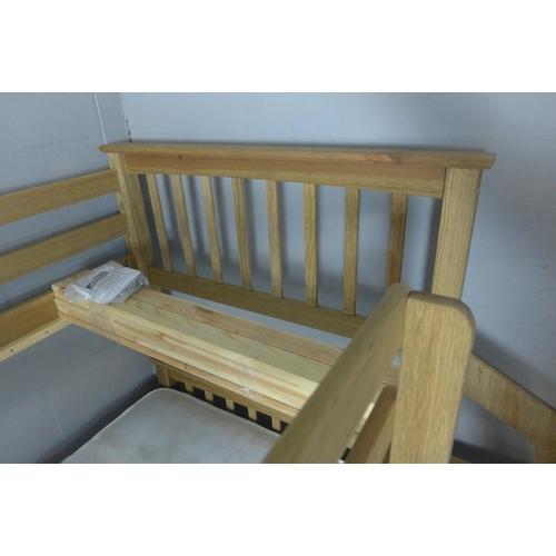 1599 - A wooden bunk bed - boxed * this lot is subject to VAT