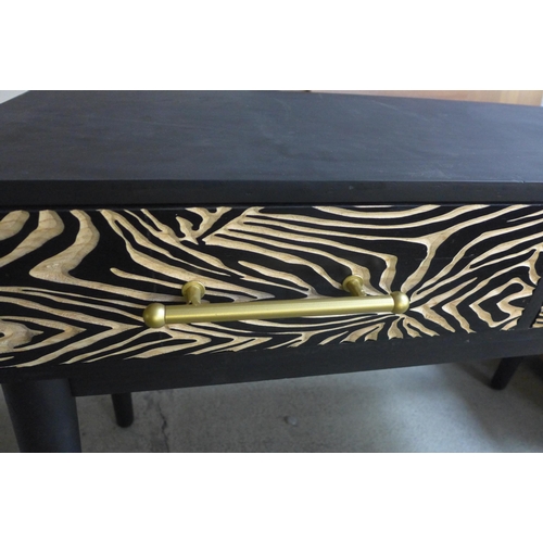 1608 - A zebra effect console table