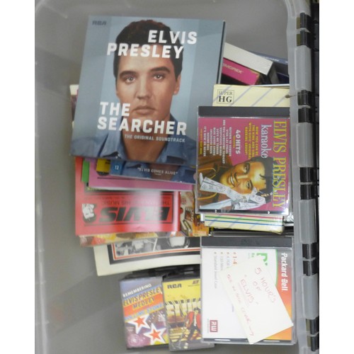 1115 - A box of Elvis Presley VHS video cassettes (pre-recorded), cassette tapes, cartridges, books and mag... 